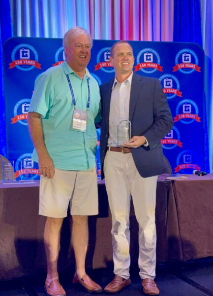 Sonny Ross, BS Pharm '73 (left), receives the 2025 GPhA President's Award from his son, Ben Ross, PharmD '08, then President of the Georgia Pharmacy Association.